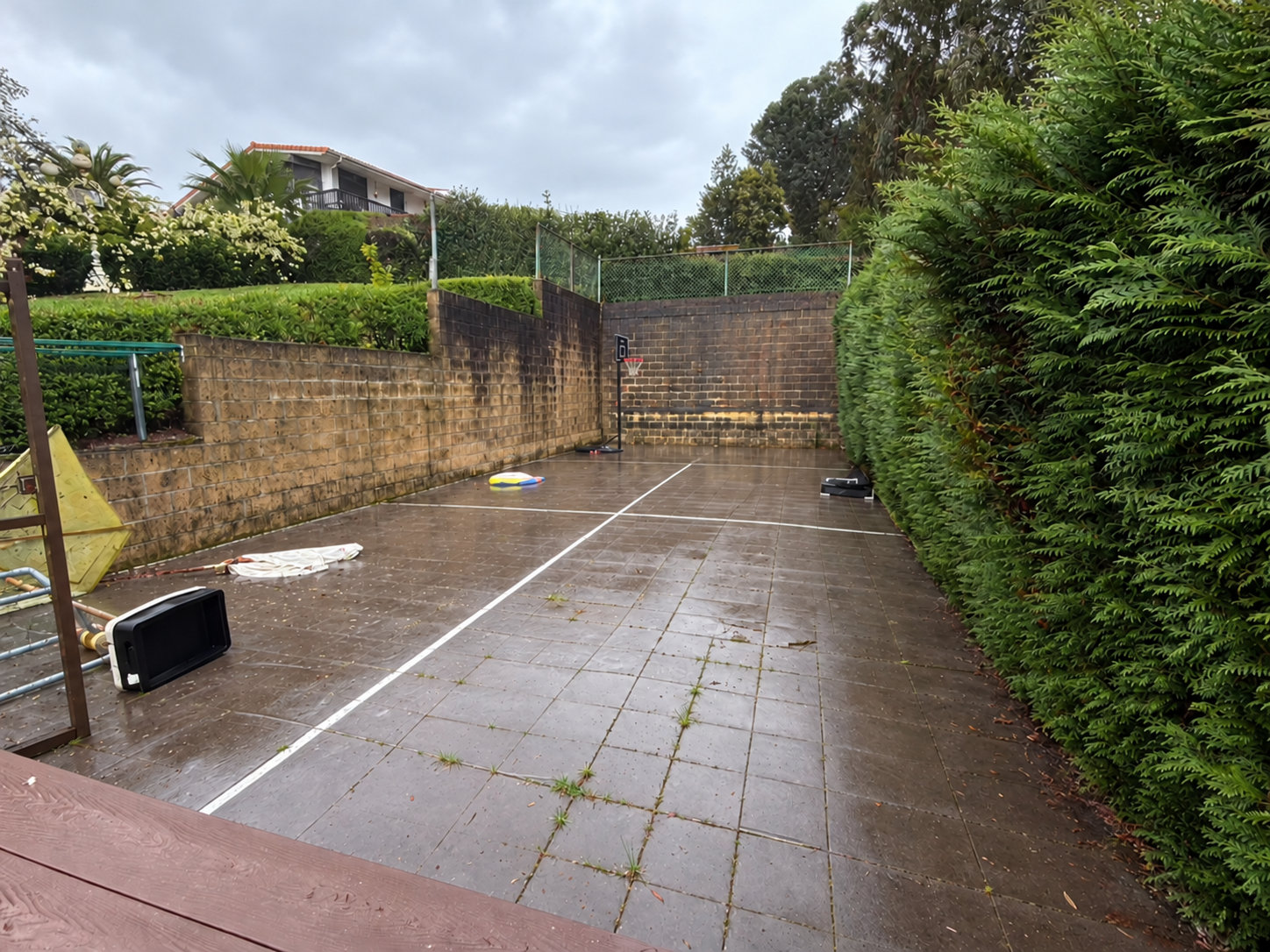 Original courtyard before the transformation; foreground wire mesh digitally removed